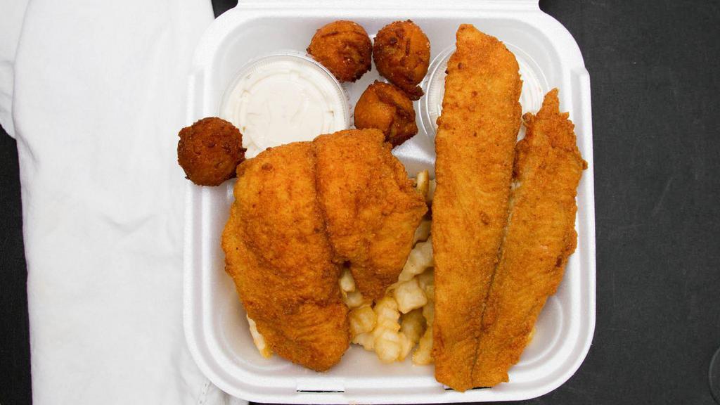 Croaker Fish Box · Served with slaw hush puppies tartar sauce and fries.