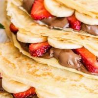 Sweet Crepe · Nutella chocolate spread and fresh sliced bananas and strawberries.