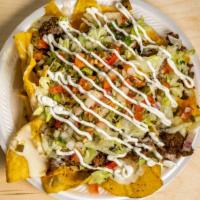 Nachos Supreme · Nachos loaded with your choice of meat, cheese dip, pico de gallo, lettuce, and sour cream.