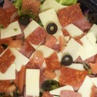 Large Garden Salad · Freshly made with lettuce, diced tomatoes, onions, green peppers, black olives, shredded car...