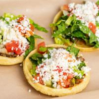 Sopes (3 Pcs) · Frijoles refritos, lechuga. Tomate, queso y crema agria. / Refried beans, lettuce. Tomato, c...