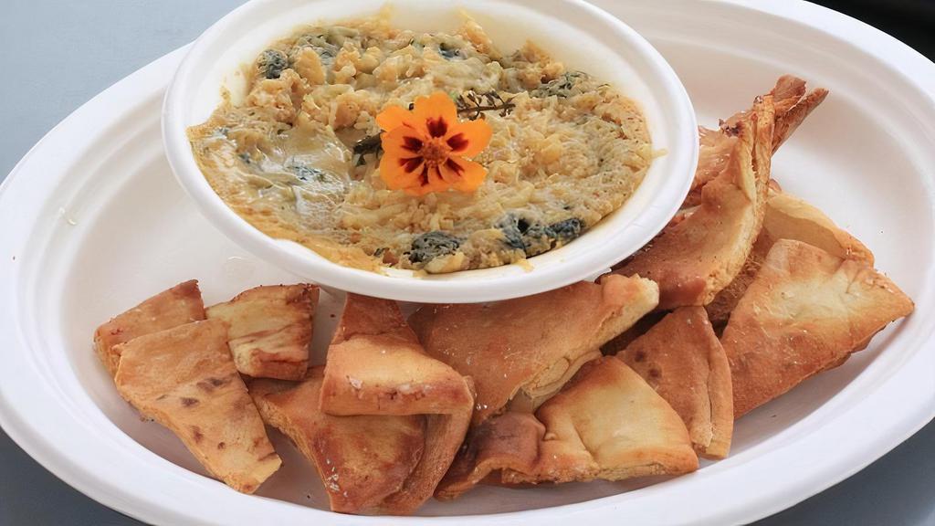 Spinach Artichoke Dip · Warmed until bubbling, served with pita or socca (+2)