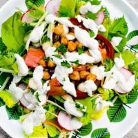 Side Salad · Chopped greens, Chickpeas and Company and a drizzle of our Aphrodite Dressing for your mini-...
