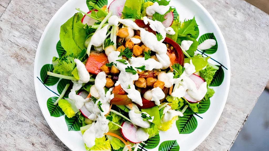 Side Salad · Chopped greens, Chickpeas and Company and a drizzle of our Aphrodite Dressing for your mini-salad needs :)