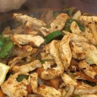 Alambre Chicken Fajitas · Tender strips of marinated chicken sautéed with onions, green peppers, tomatoes, bacon toppe...
