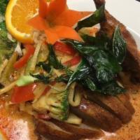 Curry Duck · Roast duck with mixed vegetables in curry sauce. Red or green or panang.