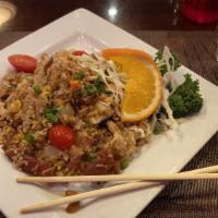 Thida Thai Fried Rice · Jasmine rice fried with egg, chicken, sweet sausage, bacon, cashew nut, dried grape, onion, ...