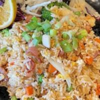 Bacon Fried Rice · Jasmine rice fried with bacon, egg, peas and carrot, onion, broccoli topped with green onion...