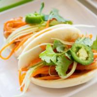 Sliders (Steamed Bun-Banh Bao) (2 Pc) · Served with aioli, cilantro, cucumbers, carrots, and jalapeno.