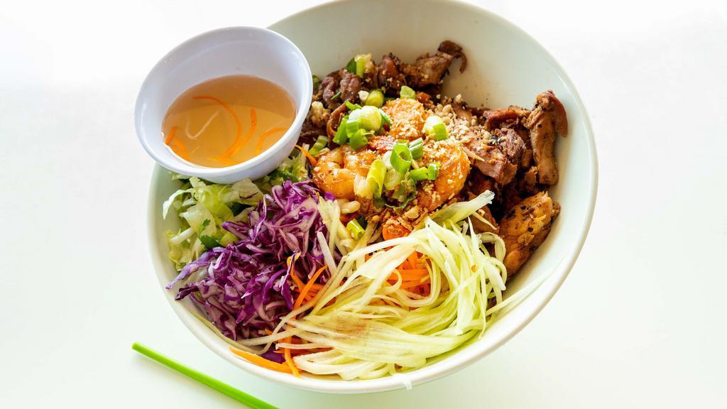 Combination · Vermicelli noodles served with shredded lettuce, carrots, cucumbers, shredded cabbage, and cilantro. Topped with green and fried onions, and peanuts. Pork, chicken, and shrimp.
