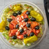 Italian Salad · Crisp mixed greens, Roma tomatoes, ripe olives, mild Italian peppers, and Romano cheese.
