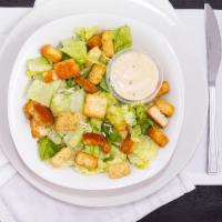 Caesar Salad · Romaine lettuce tossed with a creamy caesar dressing, Romano cheese and onion-garlic with It...