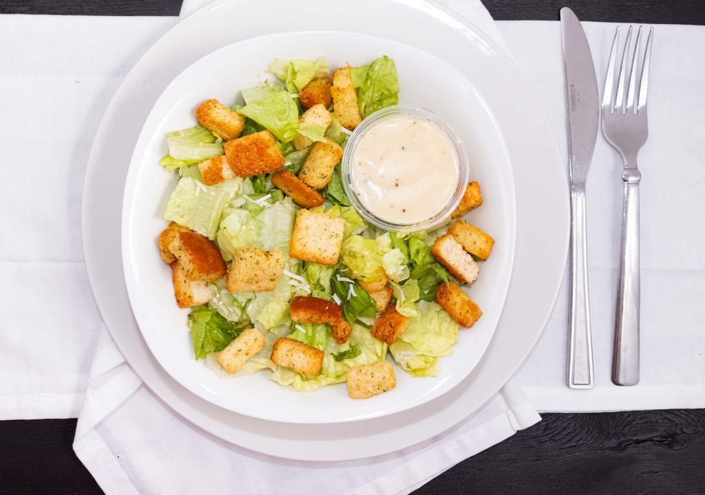 Caesar Salad · Romaine lettuce tossed with a creamy caesar dressing, Romano cheese and onion-garlic with Italian marinated chicken.