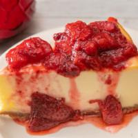 Cheesecake · New York style topped with strawberries.