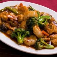 Triple Harvest · Spicy. Sliced shrimp, chicken and beef sautéed with baby corn, broccoli and carrots in gourm...
