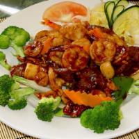 Happy Family · Spicy. Beef, prawns, pork and chicken sautéed in chef's garlic sauce and surrounded by fresh...