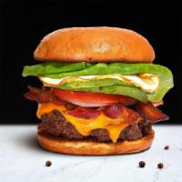 Bangin' Breakfast Burger · House-made, third pound seasoned patty perfectly cooked to medium, topped with bacon, fried ...