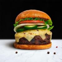 Hola Jalapeño Burgers · House-made, third pound seasoned patty perfectly cooked to medium, topped with topped with m...