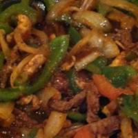 Fajitas · We use our special recipe to cook tender strips of marinated chicken breast or beef strip st...