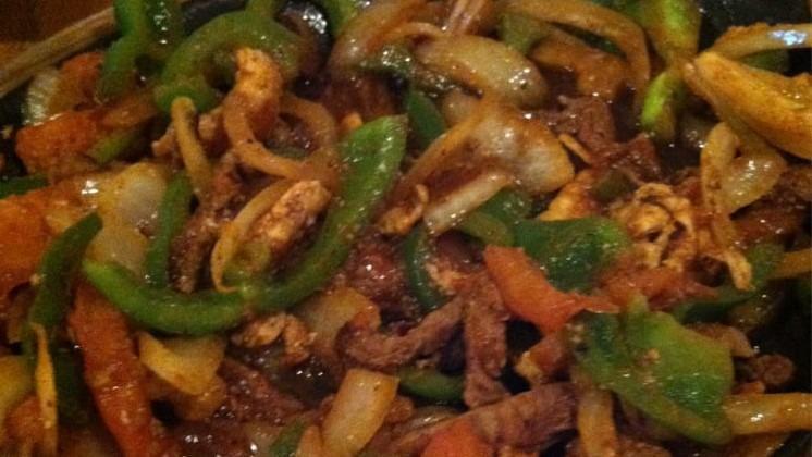 Fajitas · We use our special recipe to cook tender strips of marinated chicken breast or beef strip steak with sauteed onions, bell peppers and tomatoes. Gamished with lettuce, guacamde, sour cream and pico de gallo. Served with Mexican rice, refried beans and com or flour tortillas.