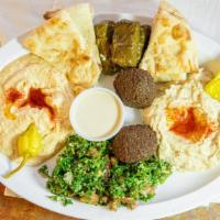 Falafel  · WITH LETTUCE, TOMATO AND LEMON TAHINI, SERVED IN A LEBANESE PITA.