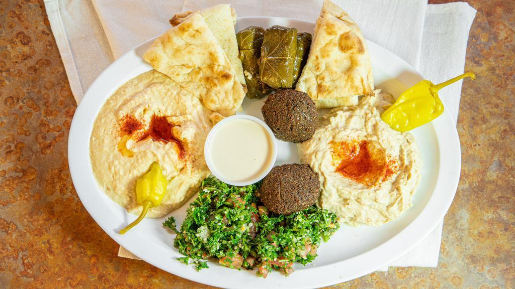 Falafel  · WITH LETTUCE, TOMATO AND LEMON TAHINI, SERVED IN A LEBANESE PITA.