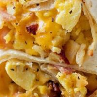 Breakfast Burrito · Eggs, cheese, hash browns and your choice of meat served in a flour tortilla with a side of ...