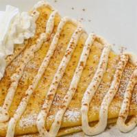 Cinnamon Roll Crepe · Cinnamon sugar and butter served in a gourmet crepe and topped with whipped cream, cinnamon ...