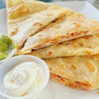 Hot Chicken Quesadilla · Shredded chicken tossed in hot chicken seasoning and melted with a Mexican cheese blend. Ser...