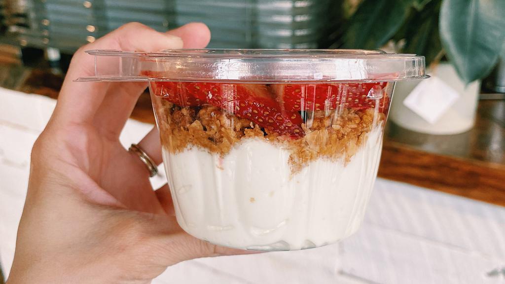 Yogurt Parfait · Plain greek yogurt topped with fresh strawberries and granola.