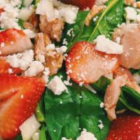 Strawberry Fields Salad · Spinach, strawberries, onion, feta, walnuts, honey balsamic reduction and olive oil