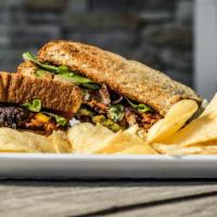 Chipotle Black Bean Veggie Burger · Guacamole, mixed greens and tomatoes on toasted multi grain bread.