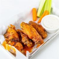 Jumbo Chicken Wings · Tossed in buffalo or housemade chipotle BBQ sauce.