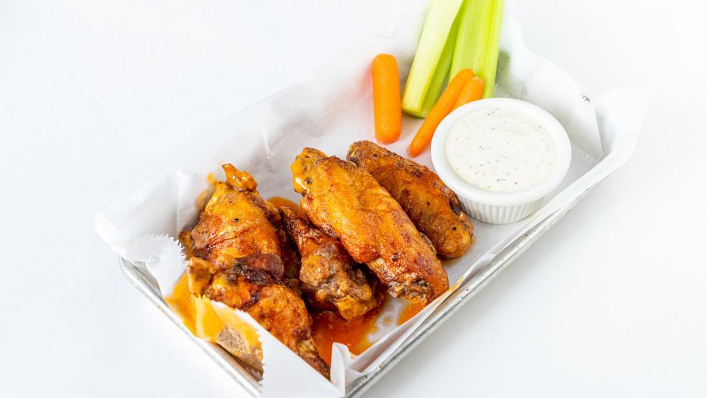 Jumbo Chicken Wings · Tossed in buffalo or housemade chipotle BBQ sauce.