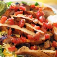 Santa Fe Fajita Salad · Mesquite grilled chicken, steak or shrimp cooked with onions. Tomatoes & green peppers. Serv...