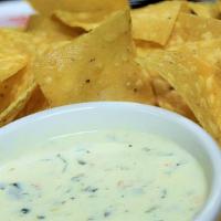 Gringo Dip · Refried beans mixed with our signature queso dip.