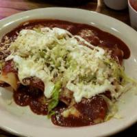 Flautas Tapatias · Four corn tortillas rolled and fried golden, stuffed with tender grilled chicken, topped wit...