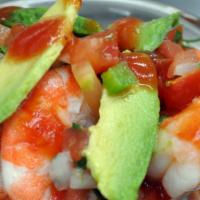 Ceviche Tampico · Chopped tilapia, shrimp and scallops marinated in lime juice topped with avocado. Pico de ga...