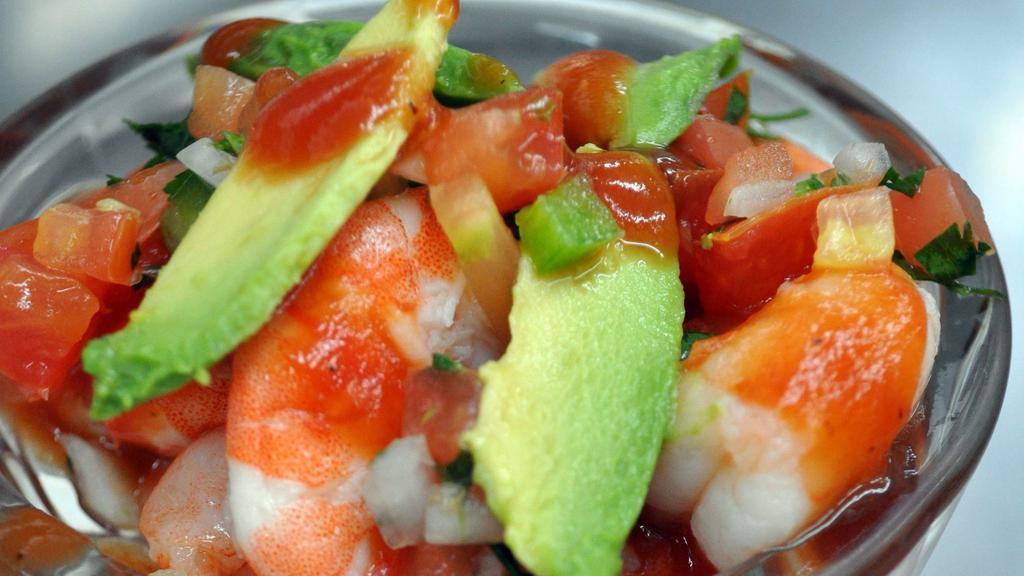 Ceviche Tampico · Chopped tilapia, shrimp and scallops marinated in lime juice topped with avocado. Pico de gallo and cilantro. Served chilled.