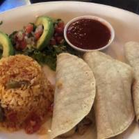 Fish Tacos · Seasoned grilled tilapia served in corn tortillas with a side of Mexican rice, lettuce, pico...