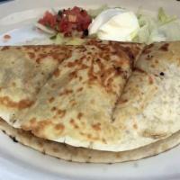 Quesadillas · Large flour tortilla filled with melted cheese and your choice of grilled steak, chicken or ...