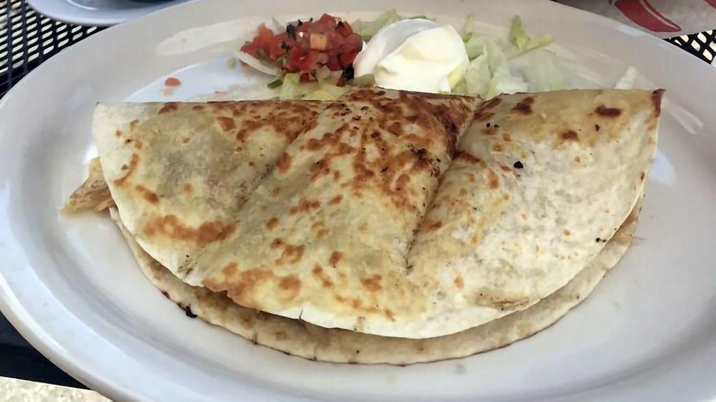 Quesadillas · Large flour tortilla filled with melted cheese and your choice of grilled steak, chicken or shrimp. Served with lettuce. Sour cream and pico de gallo.