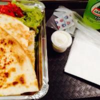 Super Quesadilla · A flour tortilla stuffed with cheese and your choice of chicken or beef. Served with rice, l...