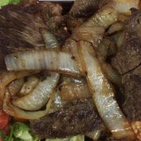Lunch Carne Azada · Skirt steak, lettuce, avocado, pico de gallo, a bowl of black beans.