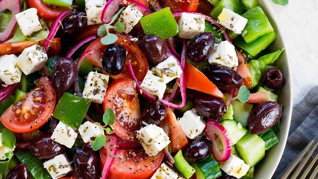 Greek Salad · Fresh lettuce, bell pepper, tomato, onion, cucumber, feta, Kalamata, olives & vinegar dressing.