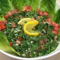Tabbouleh · Chopped parsley, bulgur, green onion topped with olive oil, and lemon juice dressing.