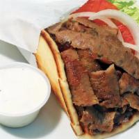Gyro Wrap · Slices of gyro meat served on a Greek pita with lettuce, tomatoes, onions and tzatziki sauce.