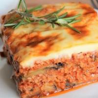 Moussaka · A layer of fried eggplants and potatoes topped with seasoned ground beef and cheesy bechamel...