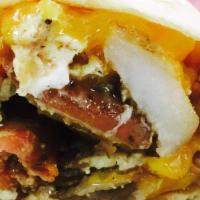 Breakfast Taco · Flour tortilla stuffed with home fries or hash browns, bacon or sausage, egg, onions and che...