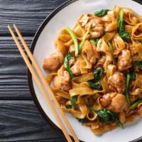 Chicken Ho Fun · Juicy chicken, onions, scallions, and flat rice noodles in a savory sauce.